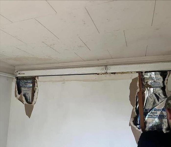 Water damage to a ceiling and interior walls. 
