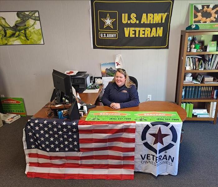 Veterans Day, Veteran Owned Small Business, Department of Veteran Affairs - image of woman at desk