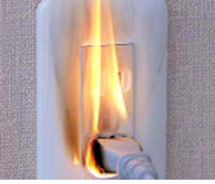Image of outlet on fire