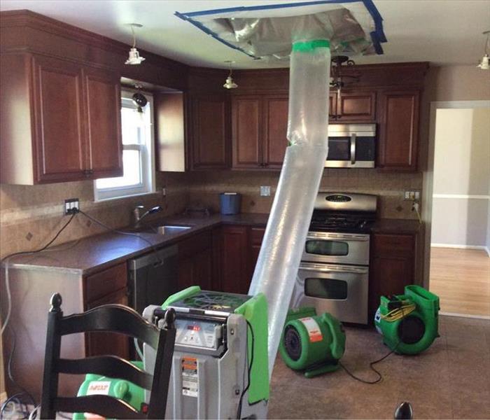 Water damage restoration service, water damage restoration in NJ - image of SERVPRO equipment in kitchen
