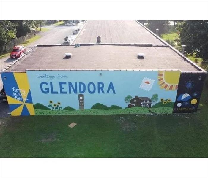 Our mural the community painted on our outside wall!